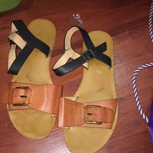 Brown and Black sandals .